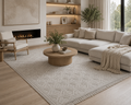 Modern living room with beige sectional sofa, wooden coffee table, and fireplace.